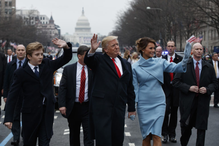 President Donald Trump and first lady Melania Trump walk along the Inauguration Day parade route after being sworn in as the 45th President of the United States, Friday, Jan. 20, 2017, in Washington.