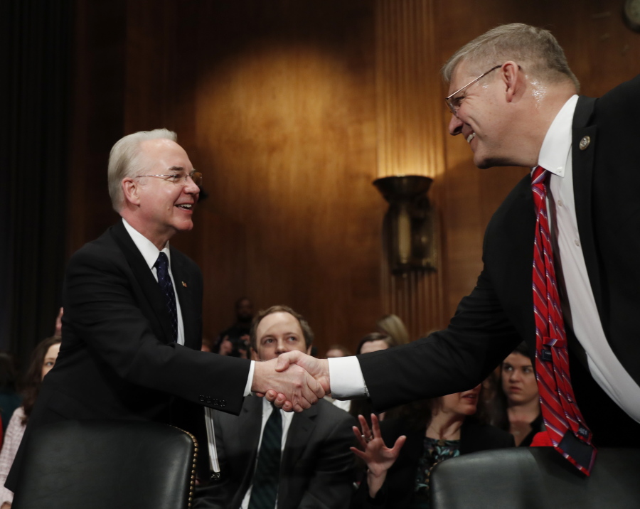 Health and Human Services Secretary-designate, Rep. Tom Price, R-Ga., left, is greeted on Capitol Hill in Washington on Wednesday by Rep. Barry Loudermilk, R-Ga., prior to testifying at this confirmation hearing before the Senate Health, Education, Labor and Pensions Committee.