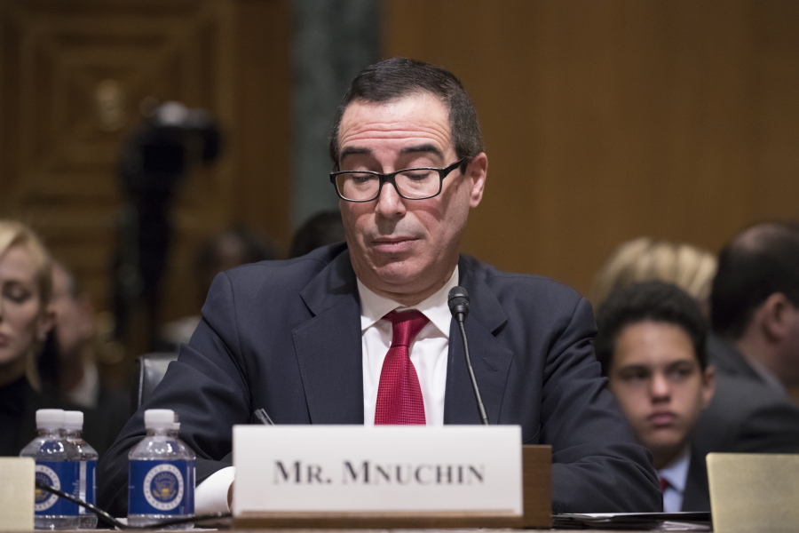 Treasury Secretary-designate Steven Mnuchin pauses while testifying on Capitol Hill in Washington on Thursday at his confirmation hearing before the Senate Finance Committee. Mnuchin built his reputation and his fortune as a savvy Wall Street investor but critics charge that he profited from thousands of home foreclosures as the chief of a sub-prime mortgage lender during the housing collapse. (AP Photo/J.