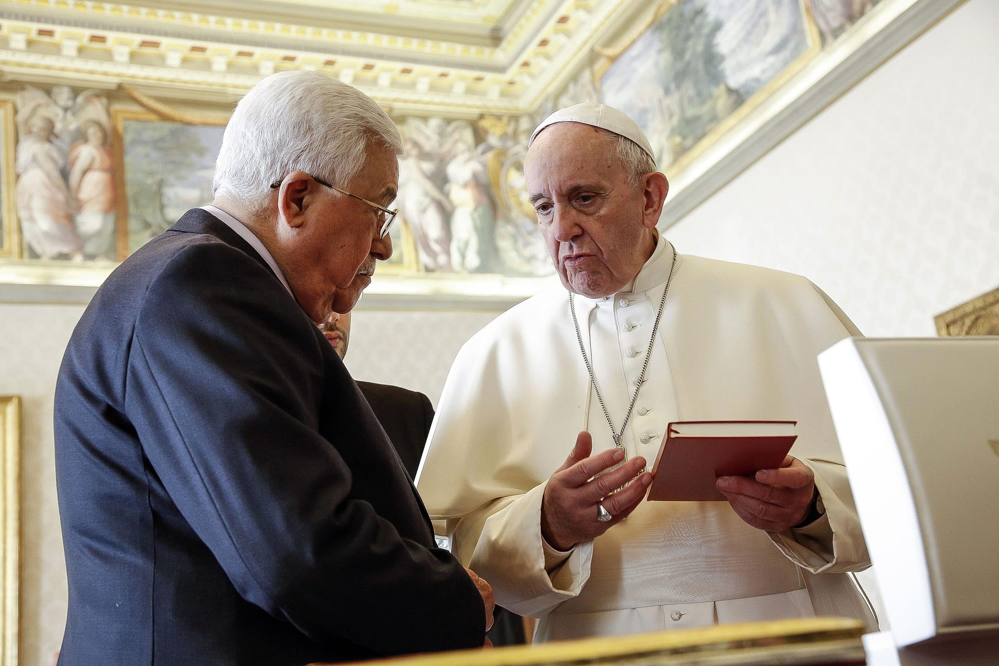 Pope Francis exchanges gifts with Palestinian President Mahmoud Abbas during a private audience at the Vatican, Saturday, Jan. 14, 2017.