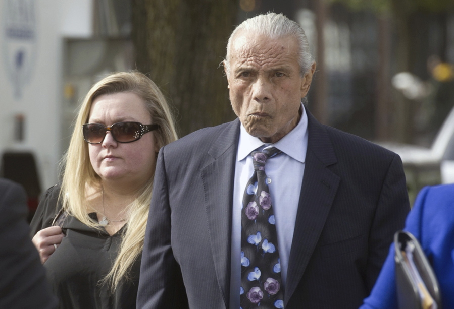 Former professional wrestler Jimmy &quot;Superfly&quot; Snuka, right, arrives for his formal arraignment in 2015 at the Lehigh County Courthouse in Allentown, Pa. In a decision filed Tuesday, Jan. 3, 2017, a Pennsylvania judge dismissed the murder case against Snuka in the 1983 death of his girlfriend Nancy Argentino, saying Snuka is not competent to stand trial on counts including third-degree murder. Snuka&#039;s attorney told a judge in December 2016 that his client is in hospice care in Florida and has six months to live.