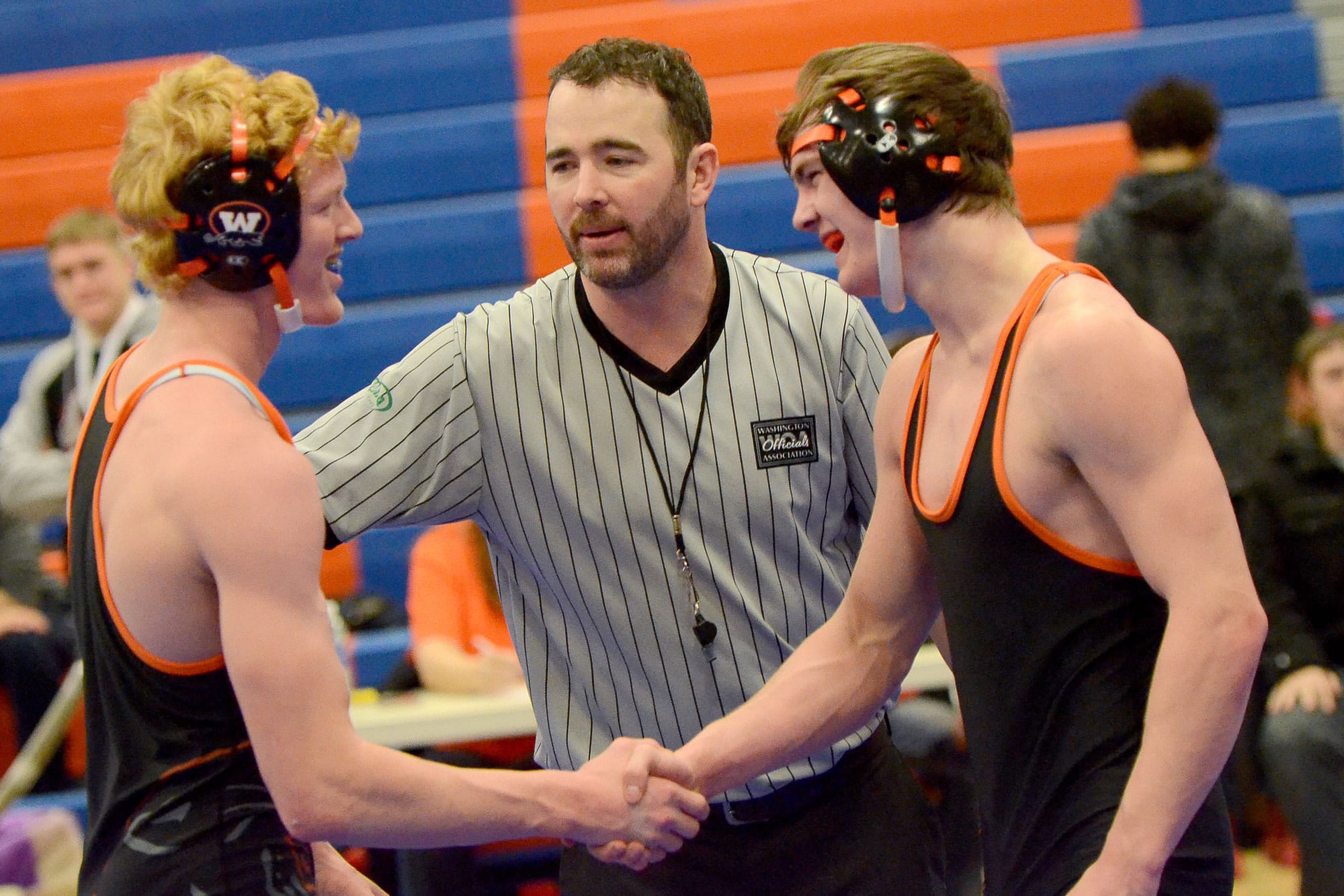 Washougal junior Tanner Lees, left, shakes teammate Nick Wolfe's hand after defeating him to win the 145-pound weight class in the 2A regional finals at Ridgefield High School on Saturday, February 11, 2017.
