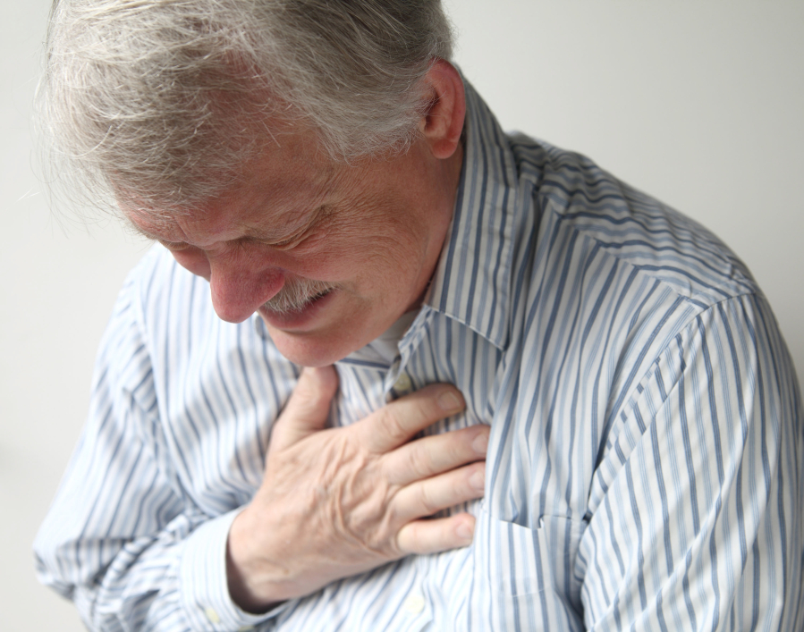 A senior man suffering from bad pain in his chest.
