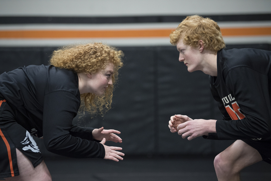 Senior Abby Lees, 17, left, and her brother, junior Tanner Lees, 16, are pictured in the wrestling room at Washougal High School on Wednesday afternoon, Feb. 15, 2017.