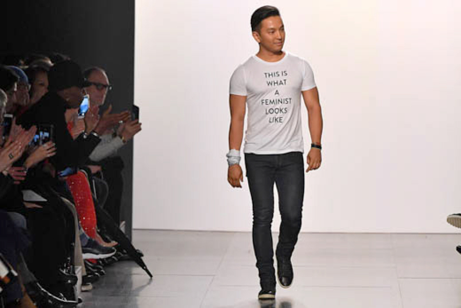 Designer Prabal Gurung takes a bow in a feminist t-shirt after presenting his Fall-Winter 2017 collection.