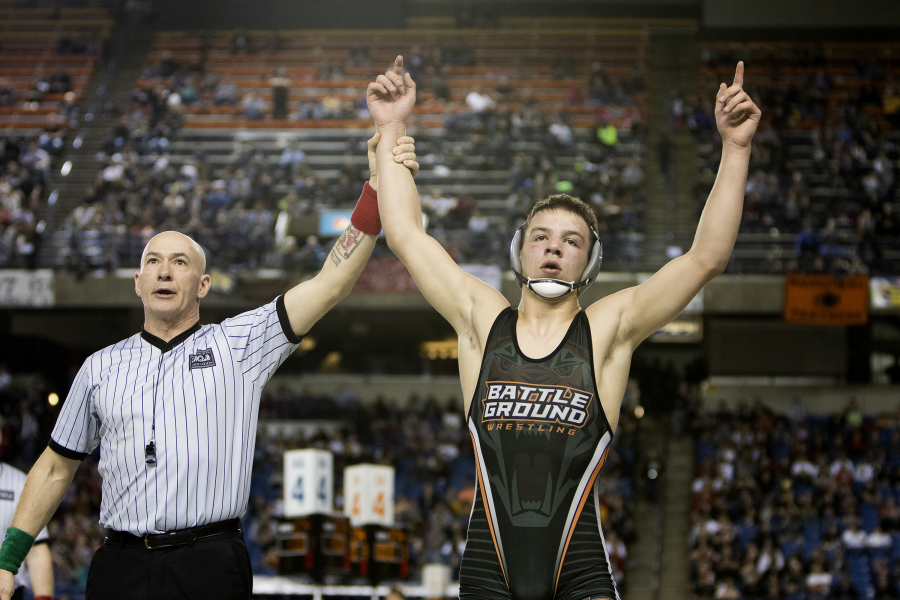 Battle Ground's James Rogers has his hands raised as a champion after taking out Curtis' Ketner Fields during their 4A 160 lb. State Wrestling championship match Saturday, Feb. 18, 2017, in Tacoma.