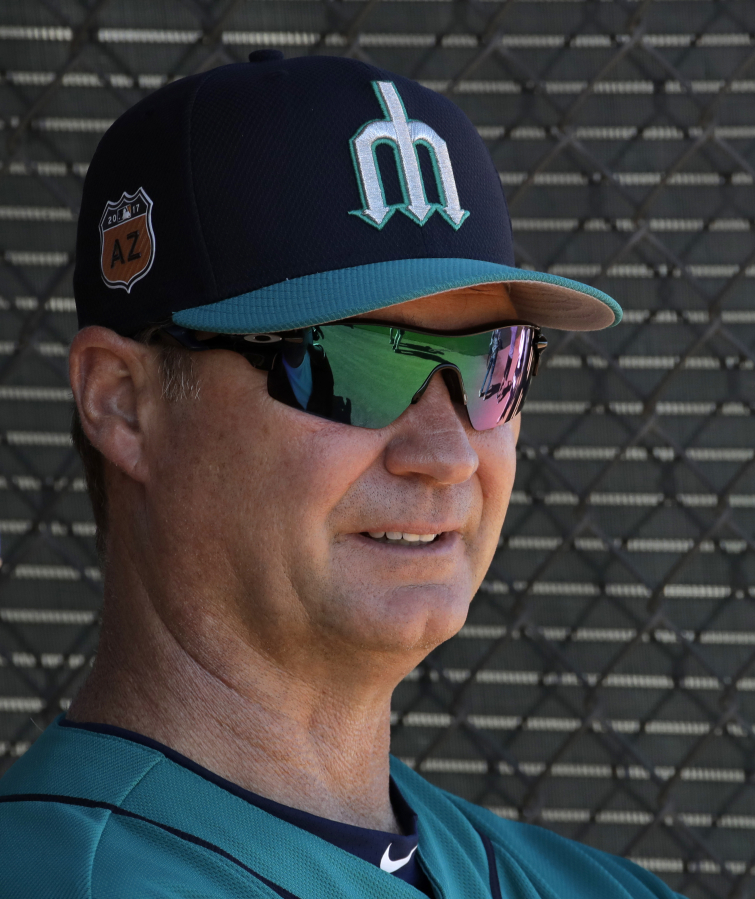 Seattle Mariners manager Scott Servais watches workouts during spring training baseball practice, Wednesday, Feb. 15, 2017, in Peoria, Ariz.