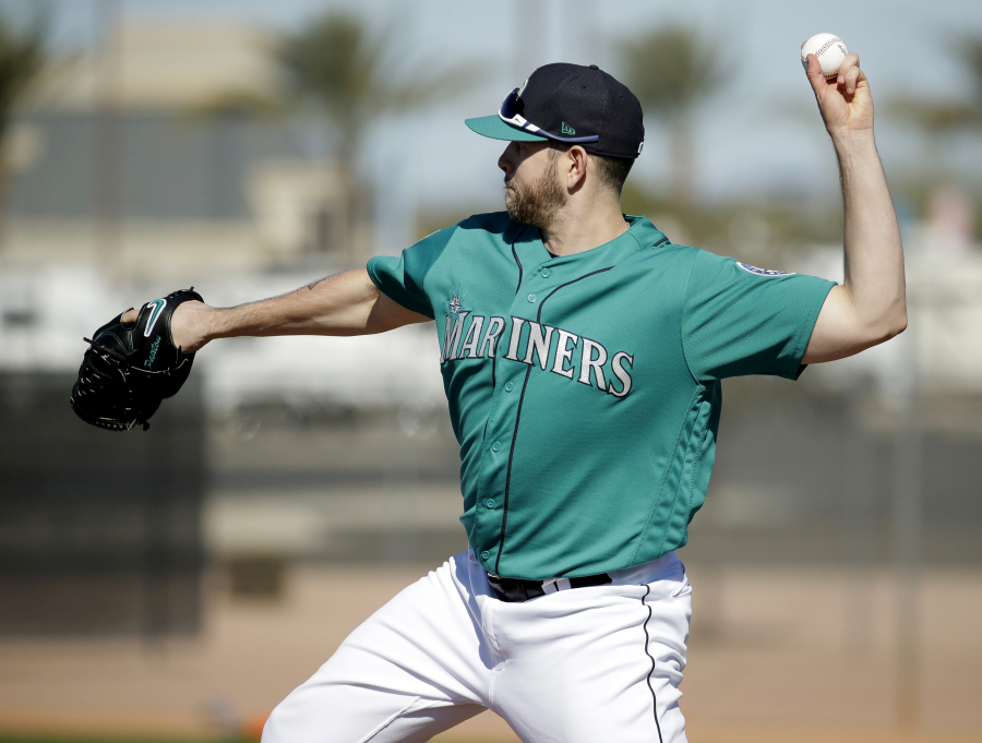 Seattle Mariners pitcher James Paxton participates in a drill during spring training baseball practice Wednesday, Feb. 15, 2017, in Peoria, Ariz.