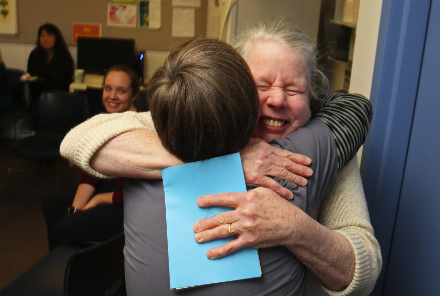 Wendy McNerthney, facing camera, the longest working nurse at the Bailey-Boushay House, one of the first places in the country to give long-term care exclusively to AIDS patients, hugs fellow registered nurse Hilary MacGregor at McNerthney&#039;s retirement party on Feb. 1 in Seattle.