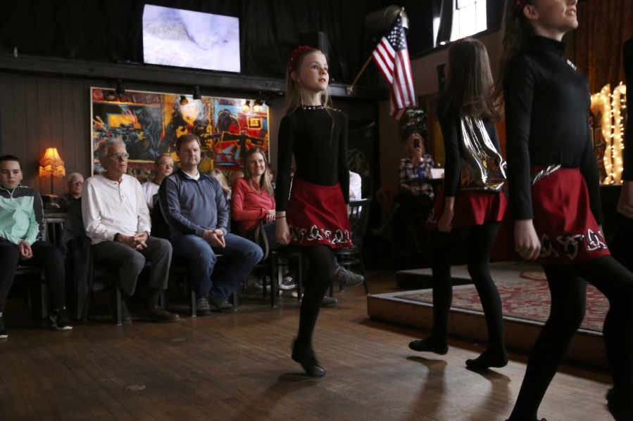 The Molly Malone Irish Dancers perform Sunday at a memorial fundraiser for the family of Amy Hooser, a Vancouver woman who was killed last month while working at the Sifton Market convenience store. The money will go into a college fund for Hooser&#039;s three daughters.