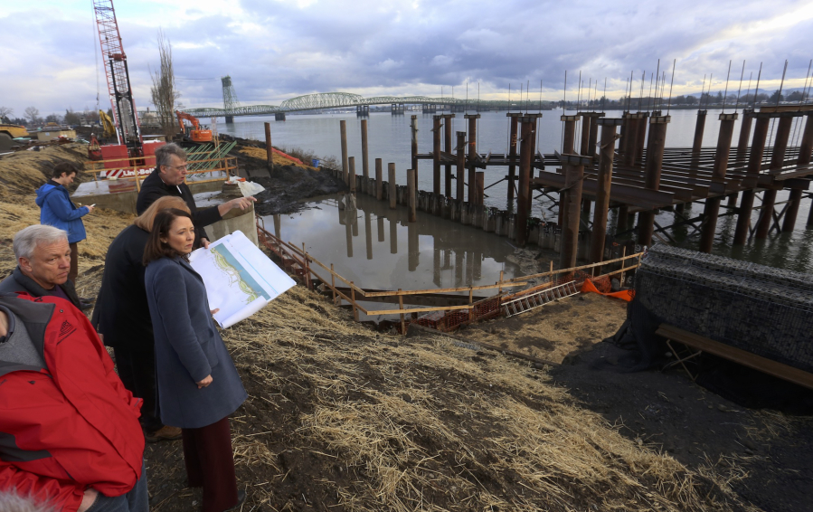 Sen. Maria Cantwell, in blue coat, visited Vancouver to tour a few sites, including the new waterfront park. City officials are hoping to bring in federal money for a few upcoming local projects.