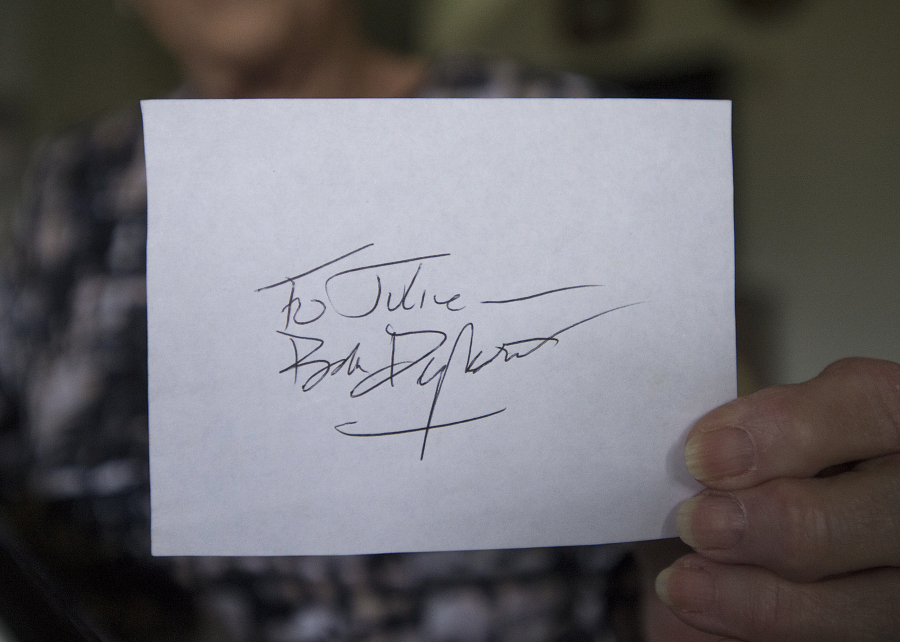 Vancouver resident Julie Sauer displays an autograph from her old friend, music legend Bob Dylan, at her home last month.