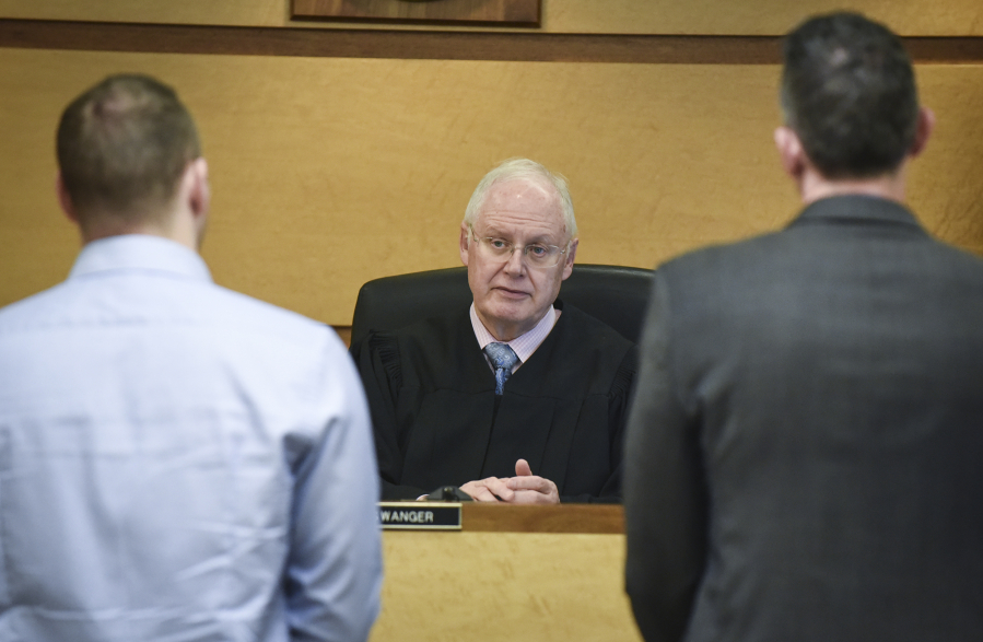 District Court Judge James Swanger presides over the morning arraignment docket Friday in his courtroom at the Clark County Courthouse. Swanger is retiring Tuesday after 18 years on the bench.