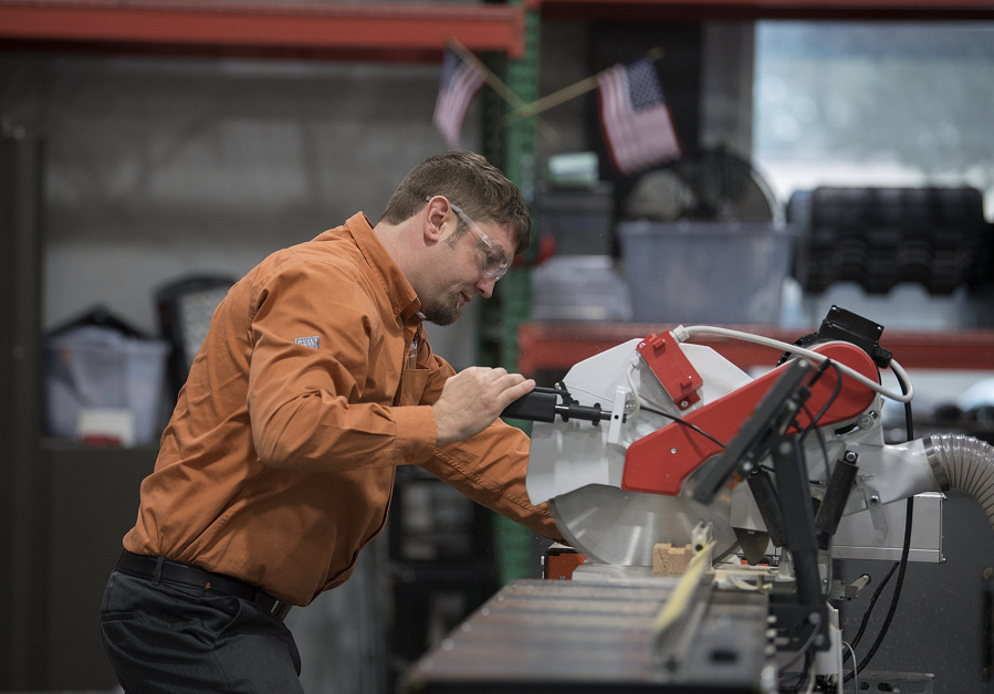 Mathias Forsman, a TigerStop representative, demonstrates one of its precision saw products. The company expects to ride the rise of automation to an 18 percent growth in revenues this year.