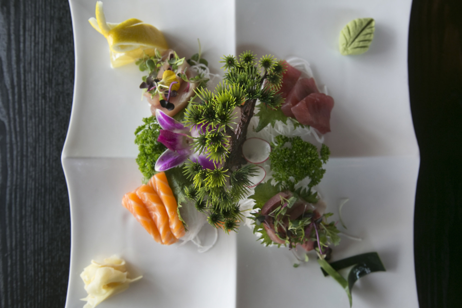 The Grand Mo Sashimi is served at Sushi Mo in downtown Vancouver. It features 12 pieces of sashimi, including tuna, salmon, yellowtail and albacore, for $28.