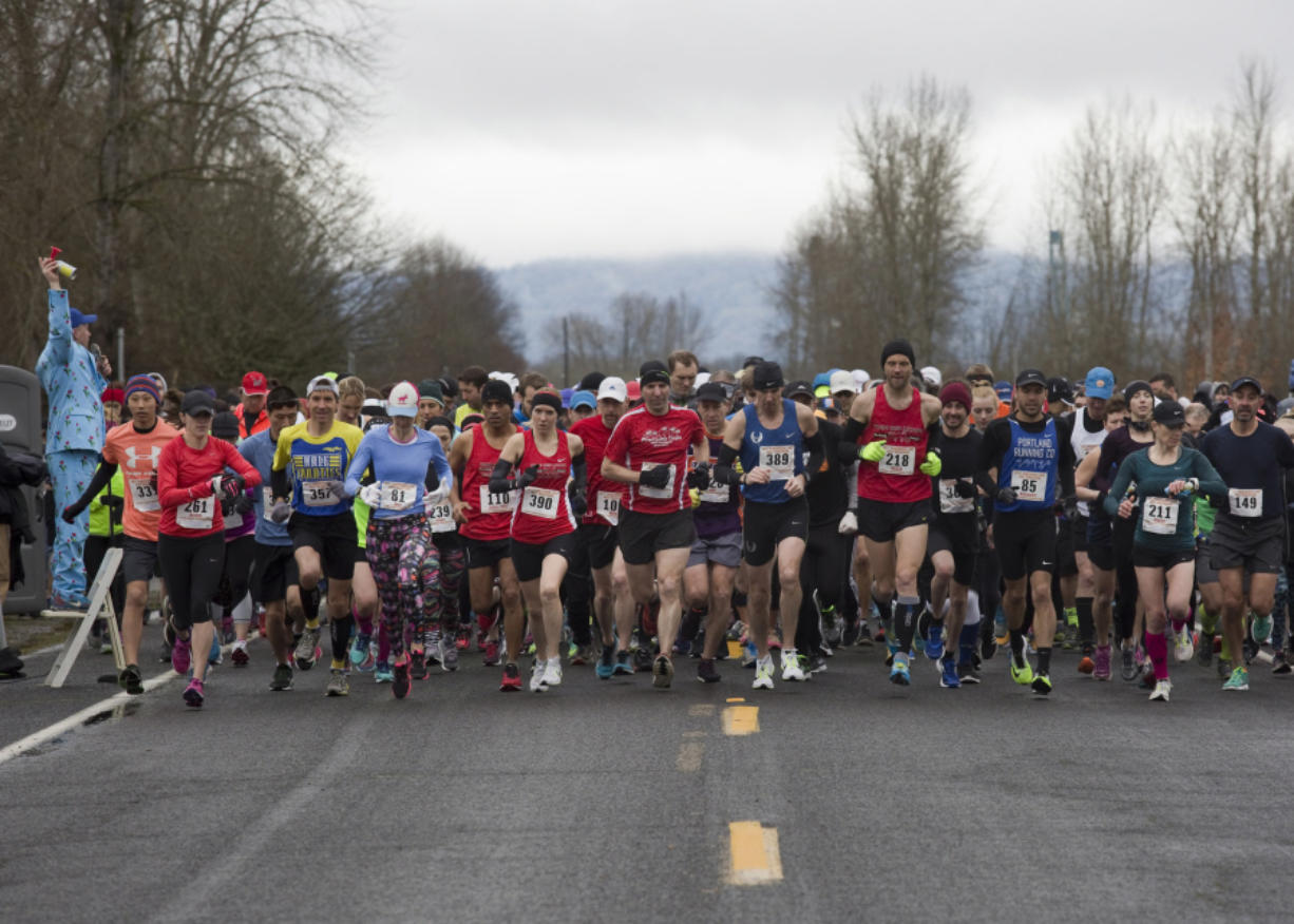 Racers take off from the starting line as they take part in the Vancouver Lake half-marathon in Vancouver Sunday Febuary 26, 2017.