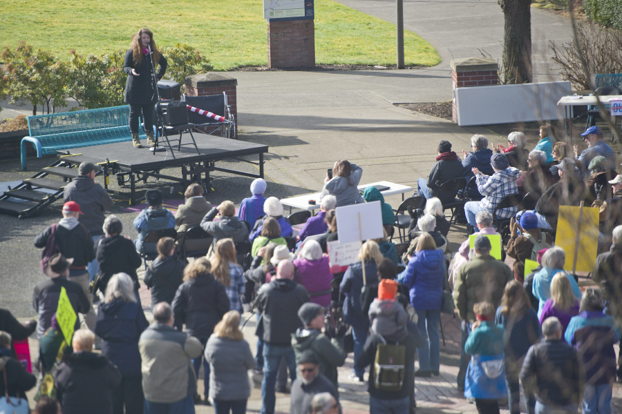 Audrey Miller of Planned Parenthood talks to people gathered for a Saturday rally to save the Affordable Care Act from repeal at Clark College in Vancouver.