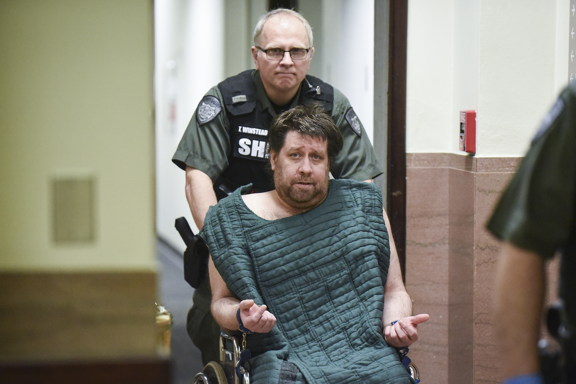 Kenneth Jay Moore, who was arrested after a two-hour standoff Friday at a Vancouver home, is wheeled into Clark County Superior Court on Feb. 21, 2017, on suspicion of murder and assault after his mother's body was found inside the residence.