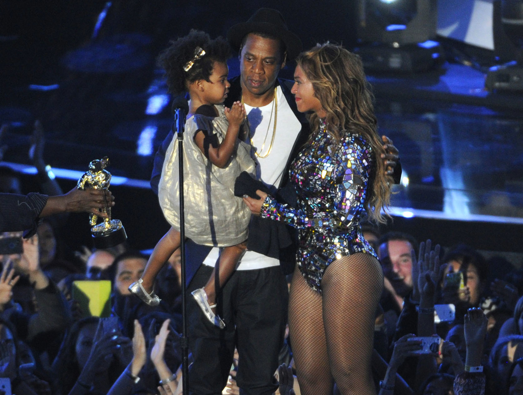 FILE - This Aug 24, 2014 file photo shows Beyonce on stage with Jay Z and their daughter Blue Ivy as she accepts the Video Vanguard Award at the MTV Video Music Awards in Inglewood, Calif. Beyonce announced on her Instagram account, Wednesday, Feb. 1, 2017, that she is expecting twins.