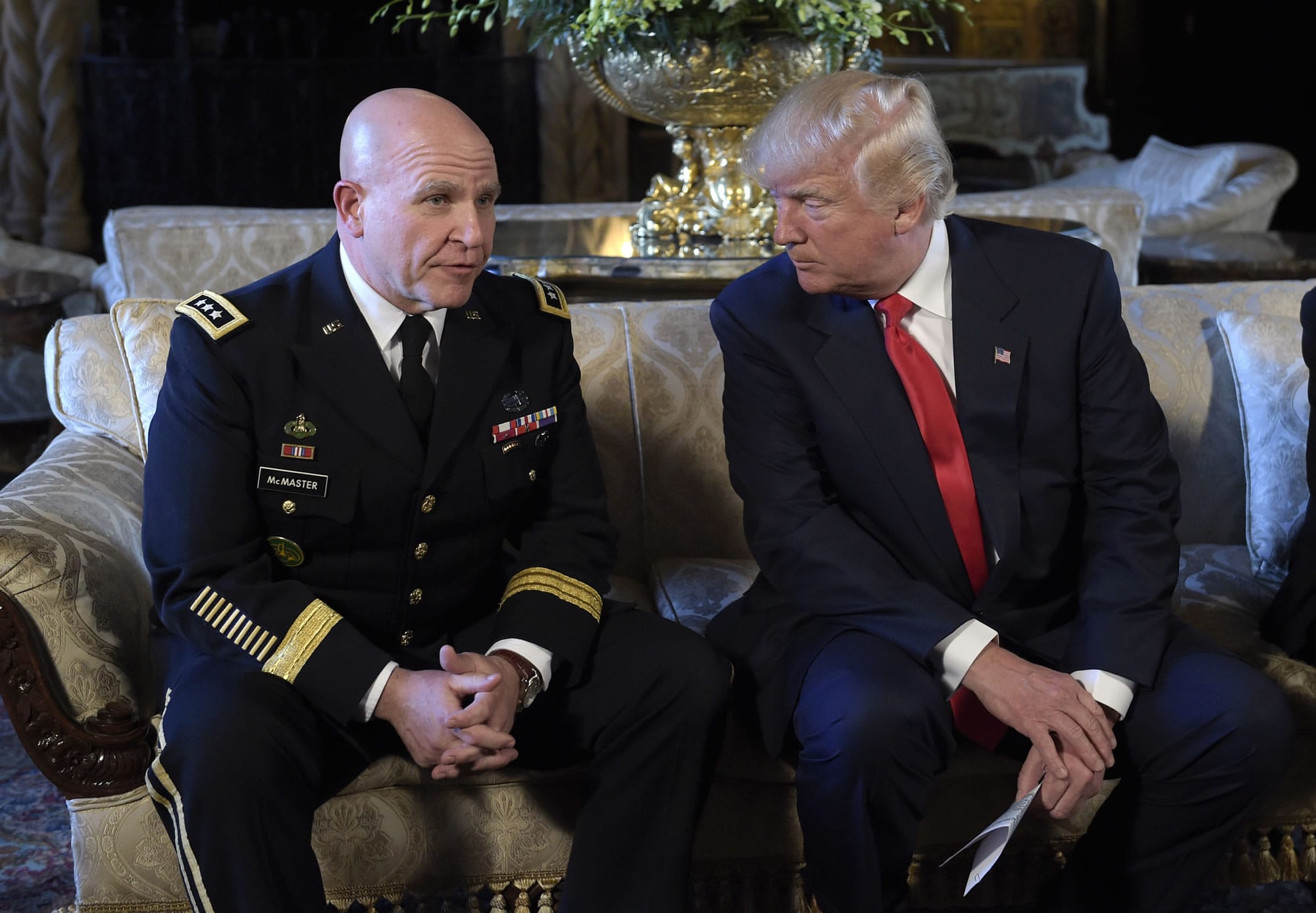 President Donald Trump, right, listens as Army Lt. Gen. H.R. McMaster, left, talks at Trump's Mar-a-Lago estate in Palm Beach, Fla., Monday, Feb. 20, 2017, where Trump announced that McMaster will be the new national security adviser.