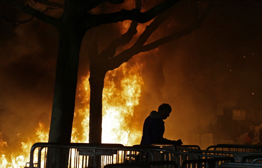 A bonfire set by demonstrators protesting an appearance by Breitbart News editor Milo Yiannopoulos burns Wednesday on Sproul Plaza on the University of California at Berkeley campus. The event was canceled.