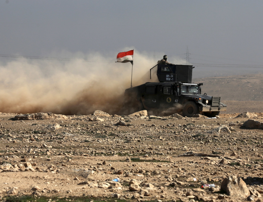 Iraqi special forces advance Friday in western Mosul, Iraq. Iraqi forces pushed into the first neighborhood in western Mosul on Friday and took full control of the international airport on the city&#039;s southwestern edge from the Islamic State group, according to Iraqi officials.