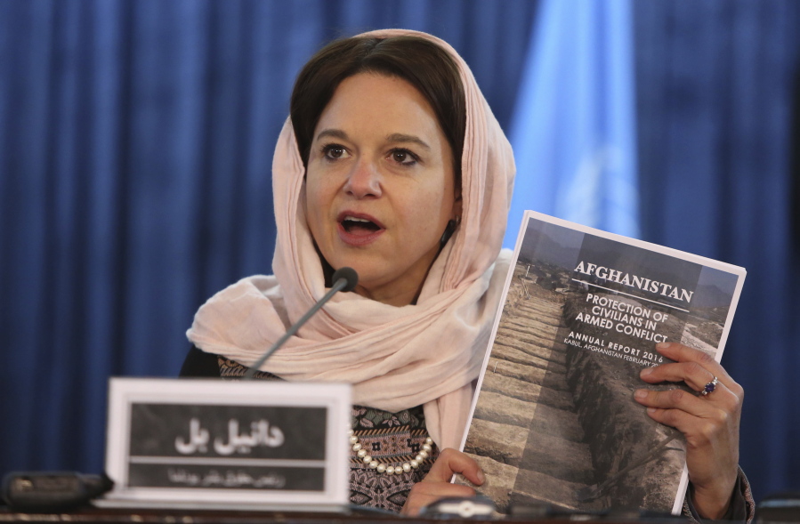 Danielle Bell, United Nations Assistance Mission in Afghanistan, UNAMA, Human Rights Director holds a copy of the U.N. 2016 Annual Report on the Protection of Civilians in Armed Conflict in Afghanistan, during a press conference in Kabul, Afghanistan, Monday, Feb. 6, 2017.  The mission  said the number of civilian casualties in the country???s conflict rose by 3 percent in 2016. It said that between Jan. 1 and Dec. 31, 2016, the mission documented 11,418 civilian casualties -- 3,498 deaths and 7,920 wounded.