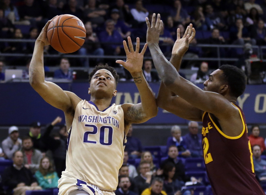 Washington guard Markelle Fultz (20) shoots against Arizona State forward Andre Adams during the first half of an NCAA college basketball game, Thursday, Feb. 16, 2017, in Seattle. (AP Photo/Ted S.