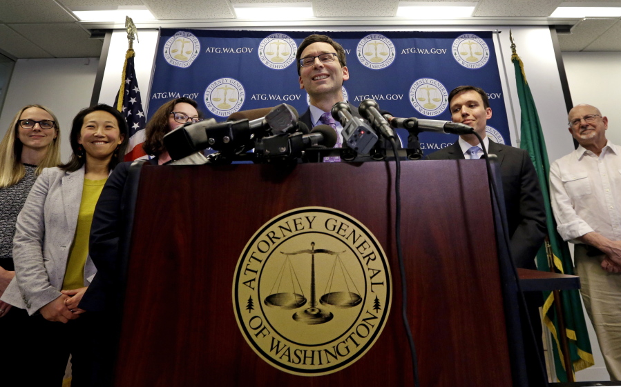 Washington Attorney General Bob Ferguson speaks at a news conference in Seattle.