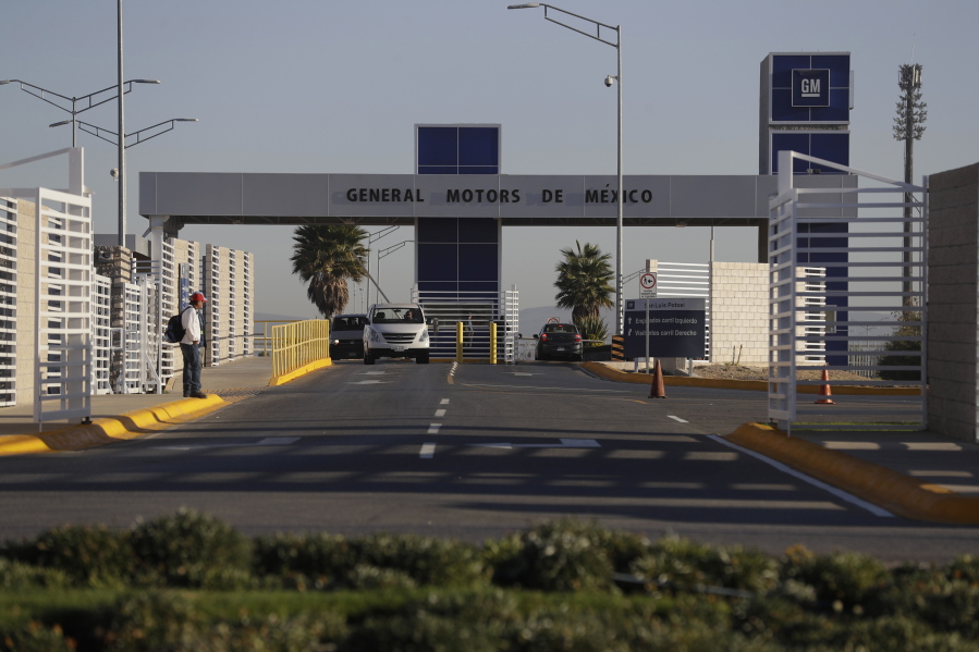 Cars exit the General Motors assembly plant in Villa de Reyes, outside San Luis Potosi, Mexico, where the Aveo and Trax vehicles have been produced since 2008.
