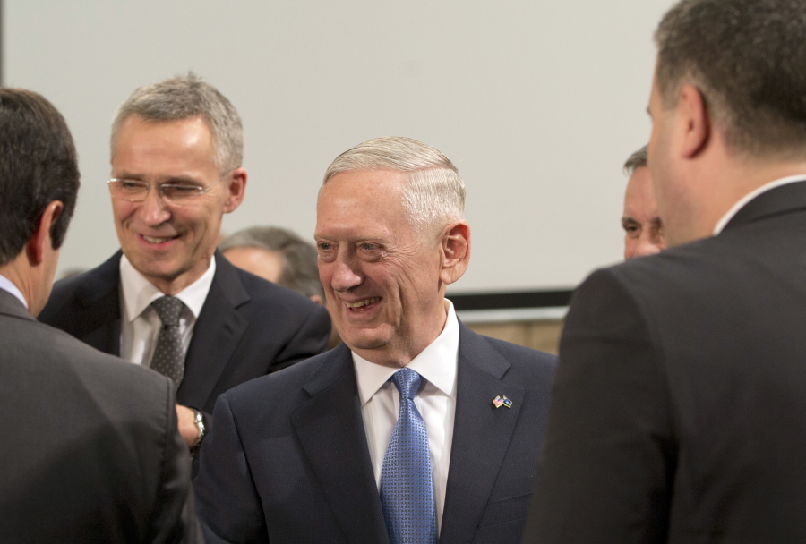 U.S. Secretary of Defense Jim Mattis, center, and NATO Secretary General Jens Stoltenberg, second right, greet members of the North Atlantic Council at NATO headquarters in Brussels on Wednesday, Feb. 15, 2017. For U.S. Defense Secretary Jim Mattis, the next few days will be a reassurance tour with a twist. He is expected to tell allies the U.S. is committed to NATO and is also hoping to secure bigger defense spending commitments.