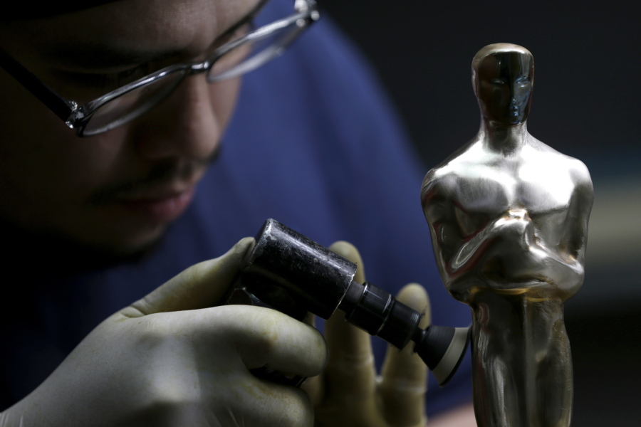 Leo Sotelo works on an Oscar statuette at the Polich Tallix Fine Art Foundry in Rock Tavern, N.Y., on Jan. 12.