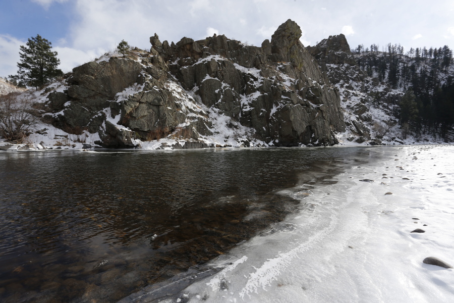 The Poudre River winds through a scenic canyon outside Fort Collins, Colo. Global warming could melt mountain snows more slowly, researchers said Feb. 27, a peculiar finding that might be bad news for the American West and other regions that depend on snow for water.