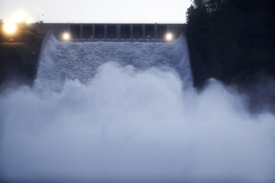Water gushes from the Oroville Dam&#039;s main spillway Tuesday, Feb. 14, 2017, in Oroville, Calif. Crews working around the clock atop the crippled Oroville Dam have made progress repairing the damaged spillway, state officials said Tuesday.