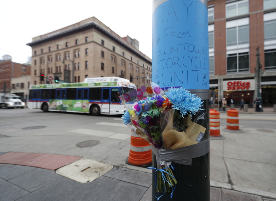 A makeshift memorial put up by Denver Police is affixed to a pole early Wednesday, Feb. 1, near the scene where a contract transit security officer was shot and killed late Tuesday, Jan. 31 in Denver. Police have not released any details about the shooting, which took place by the city&#039;s main transit hub, Union Station.