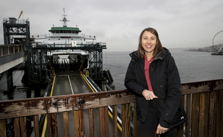 Amy Scarton, the new director of the Washington State Ferries, poses Feb. 8 at Colman Dock in Seattle. Her experience with multiple modes of travel leads her to &quot;see a ferry trip as not just dock-to-dock but door-to-door,&quot; she said.