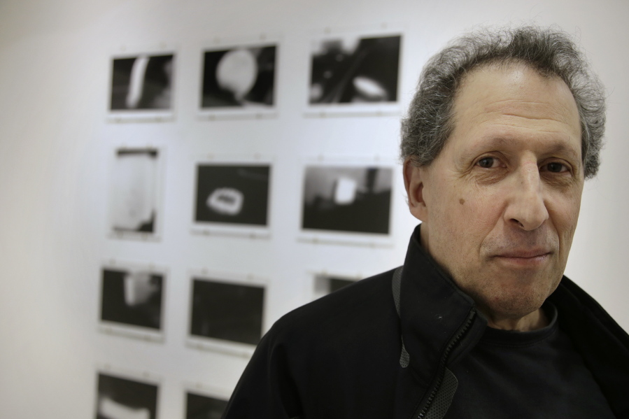 Photographer Karl Baden, of Cambridge, Mass., stands for a photo Feb. 22 in front of an exhibit of his photographs from 1976 called &quot;Thermographs,&quot; at the Miller Yezerski Gallery, in Boston. On Feb. 23, 1987, long before they were called selfies, Karl Baden snapped a simple black and white photo of himself. Then he repeated it, every day but one, for the next three decades. Baden&#039;s &quot;Every Day&quot; project turned 30 years old Thursday.