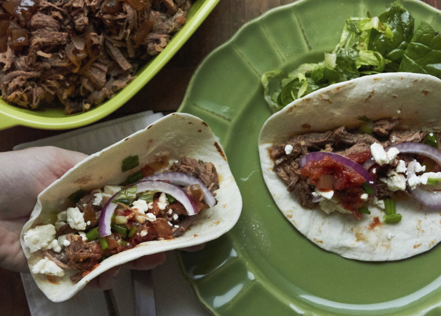Barbacoa beef tacos (Mia via AP)
