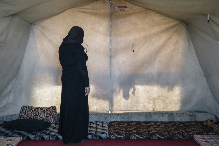 39-year-old Gorwe stands inside the tent she shares with family members at the Sharya camp for civilians displaced by war in Iraq. She escaped Islamic State militant captivity and has two sisters-in-law who are now living in Germany and receiving treatment in German trauma specialist Jan Kizilhan&#039;s program.