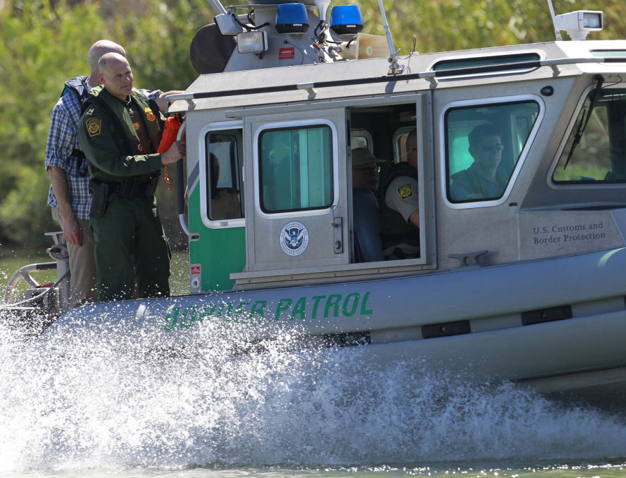 A U.S. Customs and Border Protection boat carrying U.S. Speaker of the House Paul Ryan travels down the Rio Grande on Wednesday, south of Mission, Texas.