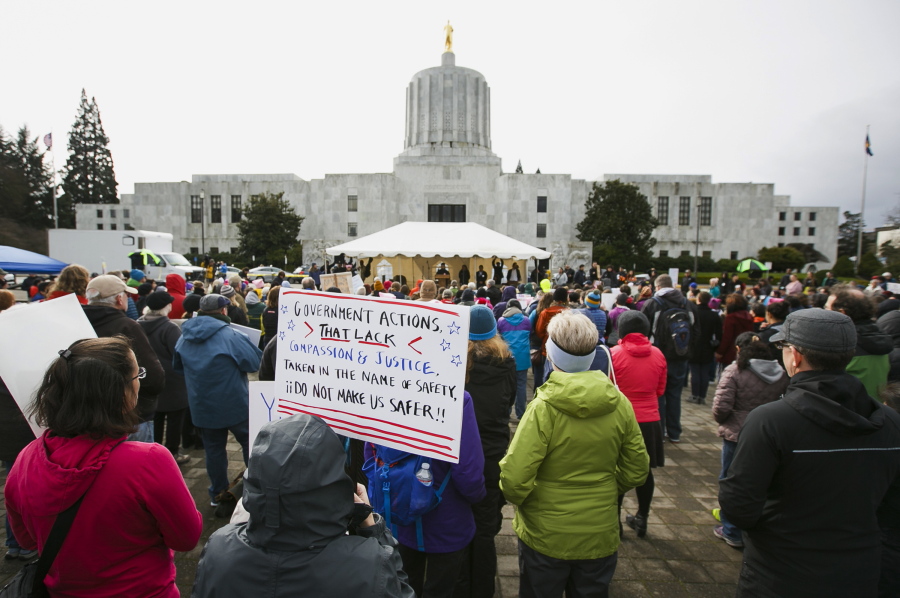 Hundreds gather at an immigration rights rally in front of the Capitol on Sunday in Salem, Ore. (Molly J.