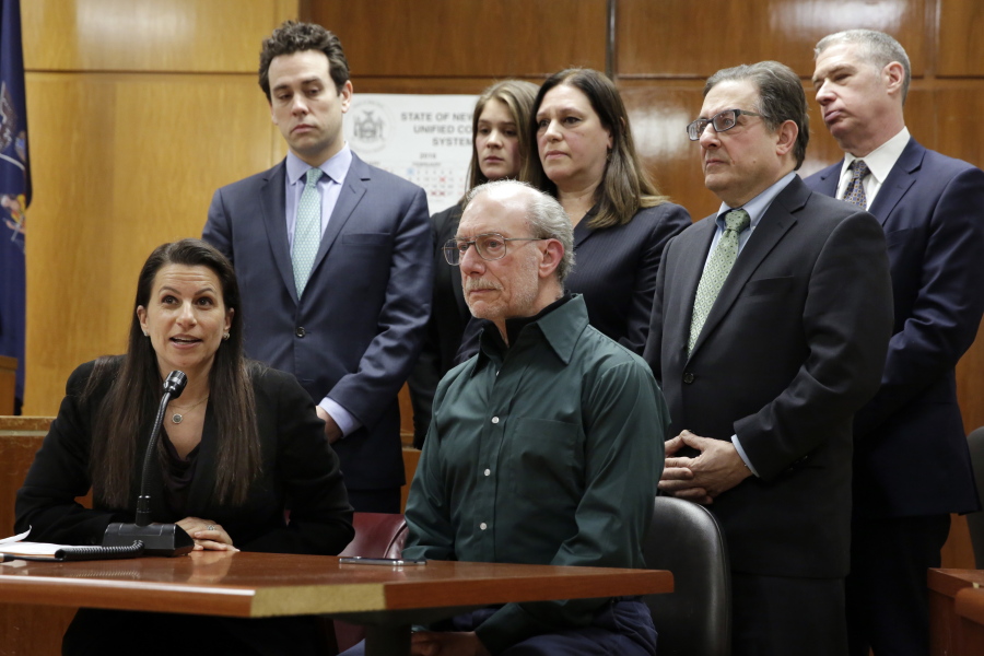 Assistant District Attorney Karen Agnifilo, foreground left, with fellow assistant district attorneys, and Stan Patz, foreground right, father of 6-year-old Etan Patz who disappeared on the way to the school bus stop 38 years ago, answer questions at a news conference in Manhattan Supreme Court, following the second trial of Pedro Hernandez, who was convicted of killing the boy, Tuesday, Feb. 14, 2017, in New York.