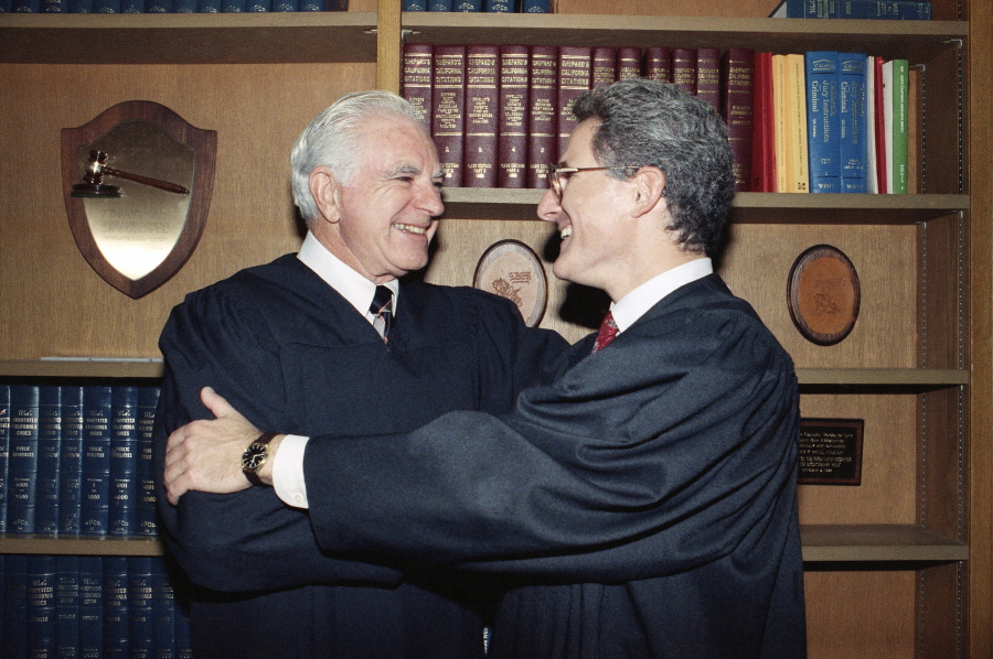 In this Friday, Oct. 13, 1989, file photo, retired Judge Joseph A. Wapner of TV&#039;s &#039;The People&#039;s Court&#039; congratulates his son, Judge Frederick N. Wapner, right, as he was enrobed as a Municipal Court judge in Los Angeles. Wapner, who presided over &quot;The People&#039;s Court&quot; with steady force during the heyday of the reality courtroom show, has died. Wapner died at home in his sleep Sunday, Feb. 26, 2017, according to his son, David Wapner.