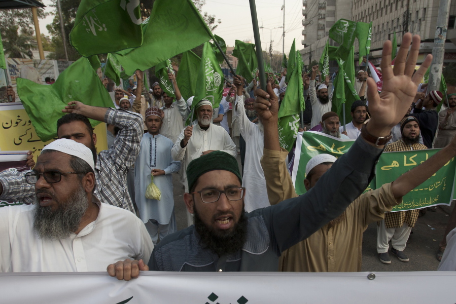 People protest Friday against a recent attack at a shrine in Karachi, Pakistan. A brutal attack on a beloved Sufi shrine that killed dozens of people raised fears that the Islamic State group has become emboldened in Pakistan, aided by an army of homegrown militants benefiting from hideouts in neighboring Afghanistan, analysts and officials said Friday.