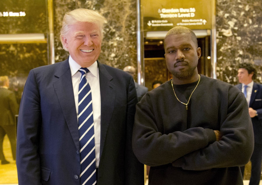 President-elect Donald Trump and Kanye West pose for a picture in the lobby of Trump Tower in New York on Dec. 13. West has deleted tweets posted on Dec. 13 explaining the meeting.