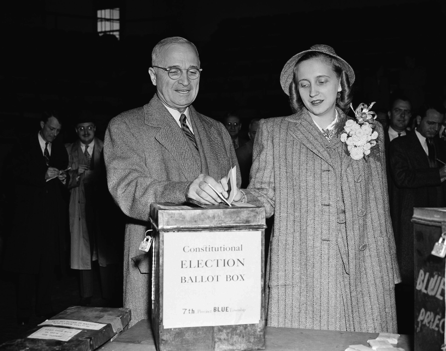 President Harry S. Truman drops his ballot in a box with his daughter, Margaret, on Nov. 5, 1946, in Independence, Mo.