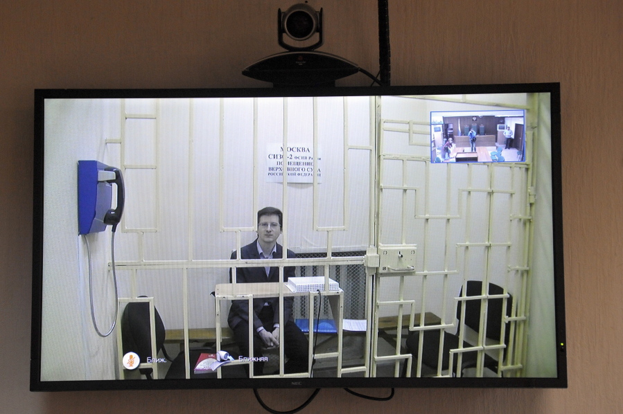 Alexander Filinov, a suspected member of a group of hackers involved in blackmailing Russian officials, seen in a video link, attends hearings in the Moscow City Court in Moscow, Russia, on Thursday. The court extended Filinov&#039;s arrest until early April pending official probe.