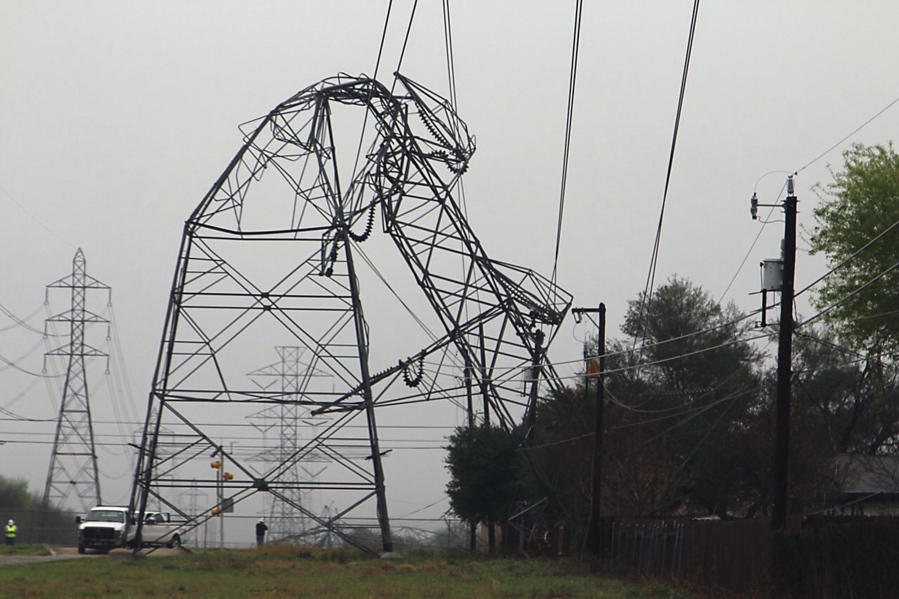 A CPS Energy transmission tower is bent in half Monday, Feb. 20, 2017, in San Antonio. Severe storms pushed at least two tornadoes through parts of San Antonio overnight, ripping the roofs off homes and damaging dozens of other houses and apartments yet causing only minor injuries, authorities said Monday.