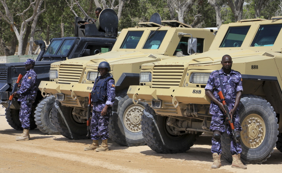 African Union soldiers stand with their armored vehicles near a checkpoint on the eve of presidential elections in Mogadishu, Somalia, on Tuesday. Graft - vote-buying, fraud, intimidation - is the top concern in a nation that Transparency International now rates as the most corrupt in the world and Mogadishu is in lockdown because of the threat of violence by homegrown Islamic extremist group al-Shabab.