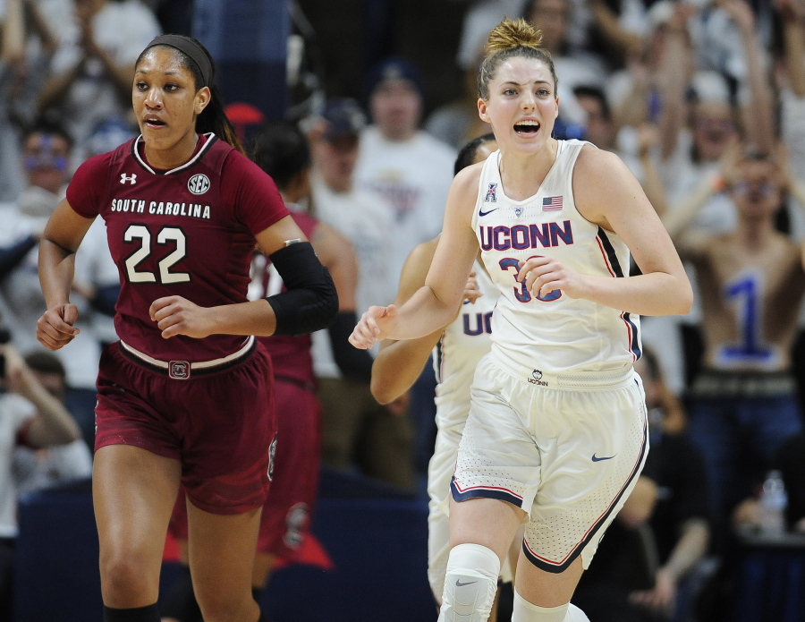 Connecticut&#039;s Katie Lou Samuelson reacts after a UConn basket as she runs up court with South Carolina&#039;s A&#039;ja Wilson, left, in the first half of an NCAA college basketball game, Monday, Feb. 13, 2017, in Storrs, Conn.